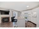 204-3204 Valleyview Park Se, Calgary, AB  - Indoor Photo Showing Kitchen With Fireplace 