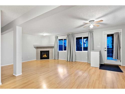 96 Sage Bank Crescent Nw, Calgary, AB - Indoor Photo Showing Living Room With Fireplace