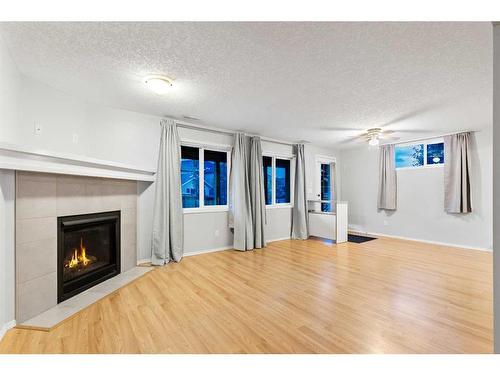 96 Sage Bank Crescent Nw, Calgary, AB - Indoor Photo Showing Living Room With Fireplace