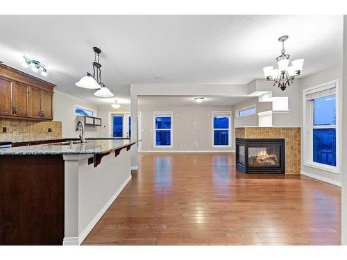 96 Sage Bank Crescent Nw, Calgary, AB - Indoor Photo Showing Kitchen With Fireplace