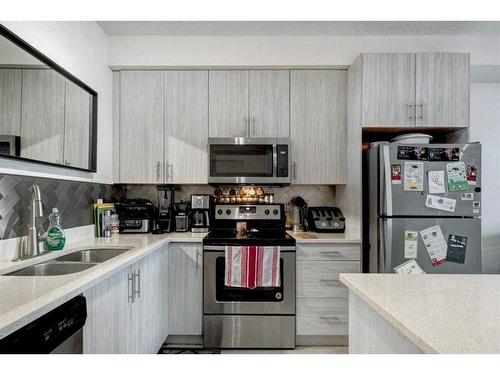 3204-215 Legacy Boulevard Se, Calgary, AB - Indoor Photo Showing Kitchen With Double Sink