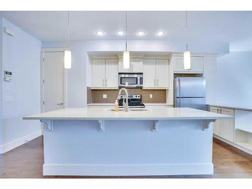 208 Quarry Park Boulevard Se, Calgary, AB - Indoor Photo Showing Kitchen With Upgraded Kitchen