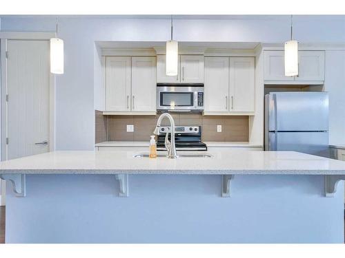 208 Quarry Park Boulevard Se, Calgary, AB - Indoor Photo Showing Kitchen With Upgraded Kitchen