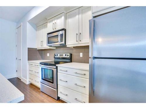 208 Quarry Park Boulevard Se, Calgary, AB - Indoor Photo Showing Kitchen With Stainless Steel Kitchen