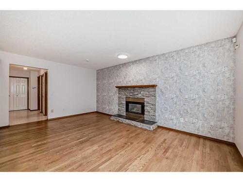 27 Coral Sands Place Ne, Calgary, AB - Indoor Photo Showing Living Room With Fireplace