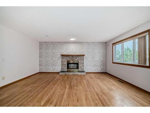 27 Coral Sands Place Ne, Calgary, AB - Indoor Photo Showing Living Room With Fireplace