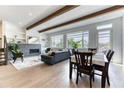 213 12A Street Ne, Calgary, AB - Indoor Photo Showing Other Room With Fireplace