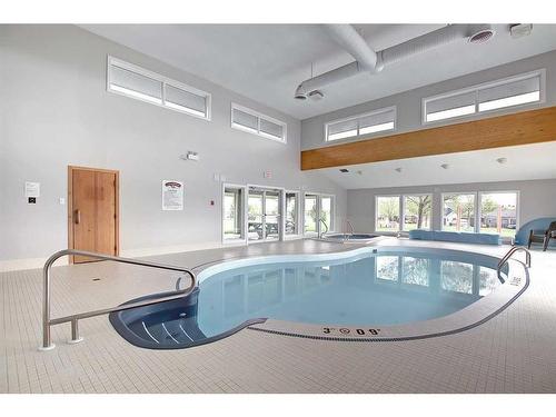 41 White Pelican Way, Rural Vulcan County, AB - Indoor Photo Showing Other Room With In Ground Pool