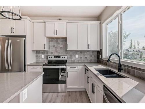 41 White Pelican Way, Rural Vulcan County, AB - Indoor Photo Showing Kitchen With Double Sink With Upgraded Kitchen