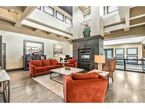 159 Aspen Meadows Place Sw, Calgary, AB - Indoor Photo Showing Living Room With Fireplace