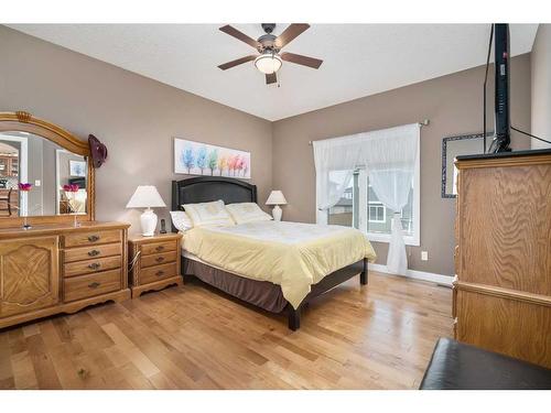 564-500 Harrison Court, Crossfield, AB - Indoor Photo Showing Bedroom