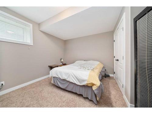 564-500 Harrison Court, Crossfield, AB - Indoor Photo Showing Bedroom