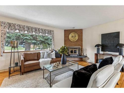 5348 La Salle Crescent Sw, Calgary, AB - Indoor Photo Showing Living Room With Fireplace