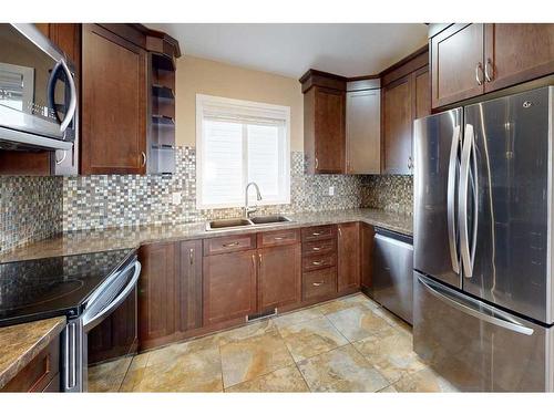 111 Mt Allan Circle Se, Calgary, AB - Indoor Photo Showing Kitchen With Double Sink