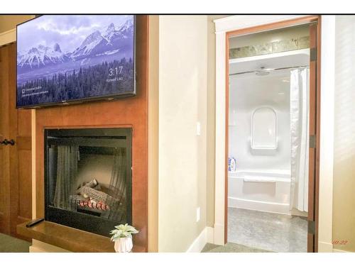 111-191 Kananaskis Way, Canmore, AB - Indoor With Fireplace