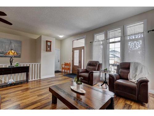 344 Willow Ride Manor, Diamond Valley, AB - Indoor Photo Showing Living Room