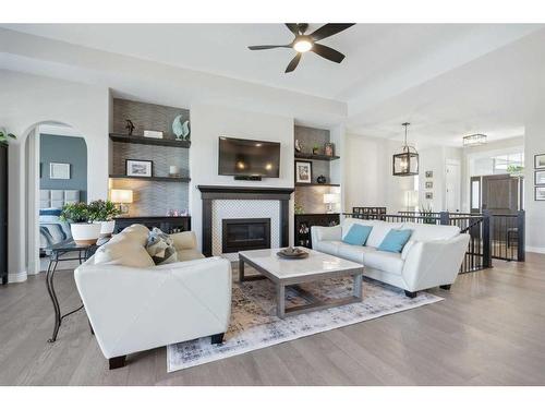 1207 Bayside Drive Sw, Airdrie, AB - Indoor Photo Showing Living Room With Fireplace