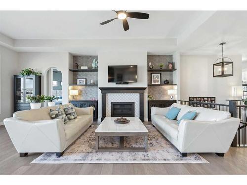 1207 Bayside Drive Sw, Airdrie, AB - Indoor Photo Showing Living Room With Fireplace