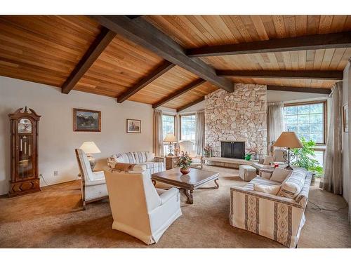 443 Wilderness Drive Se, Calgary, AB - Indoor Photo Showing Living Room With Fireplace