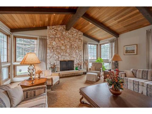 443 Wilderness Drive Se, Calgary, AB - Indoor Photo Showing Living Room With Fireplace