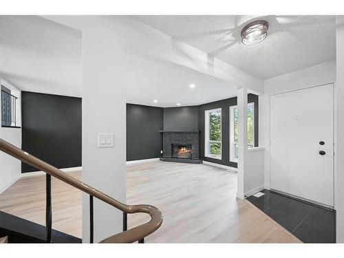 6 Canterbury Gardens Sw, Calgary, AB - Indoor With Fireplace