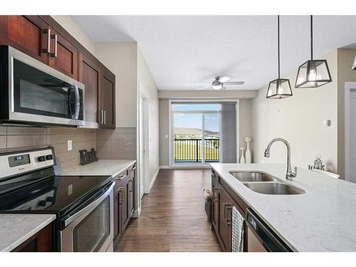 416-10 Walgrove Walk Se, Calgary, AB - Indoor Photo Showing Kitchen With Double Sink With Upgraded Kitchen