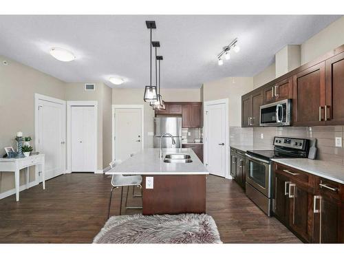 416-10 Walgrove Walk Se, Calgary, AB - Indoor Photo Showing Kitchen With Double Sink With Upgraded Kitchen