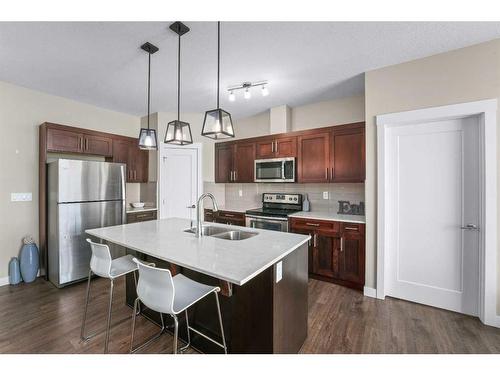 416-10 Walgrove Walk Se, Calgary, AB - Indoor Photo Showing Kitchen With Double Sink With Upgraded Kitchen