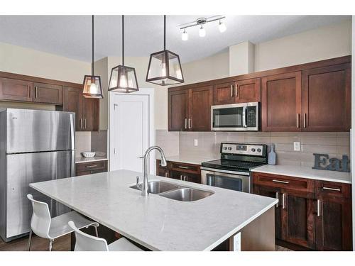 416-10 Walgrove Walk Se, Calgary, AB - Indoor Photo Showing Kitchen With Double Sink With Upgraded Kitchen