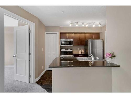 1307-81 Legacy Boulevard Se, Calgary, AB - Indoor Photo Showing Kitchen With Double Sink