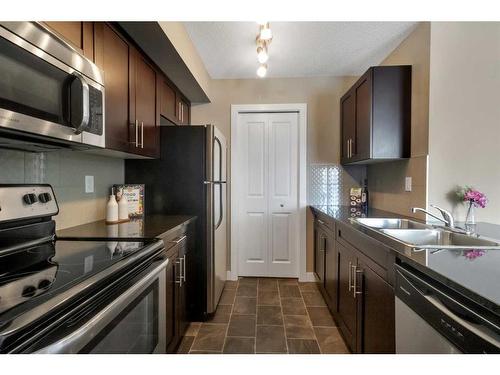 1307-81 Legacy Boulevard Se, Calgary, AB - Indoor Photo Showing Kitchen With Double Sink