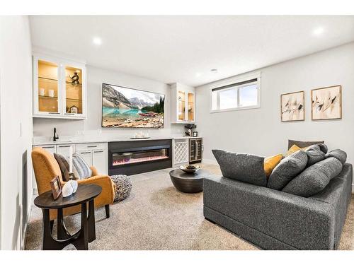 210 Blackstone Road, Balzac, AB - Indoor Photo Showing Living Room With Fireplace