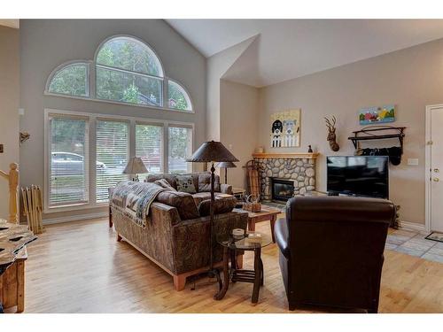 1-137 Stonecreek Road, Canmore, AB - Indoor Photo Showing Living Room With Fireplace