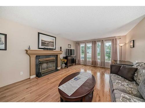 4509 49 Street, Sylvan Lake, AB - Indoor Photo Showing Living Room With Fireplace