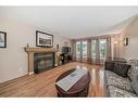 4509 49 Street, Sylvan Lake, AB  - Indoor Photo Showing Living Room With Fireplace 