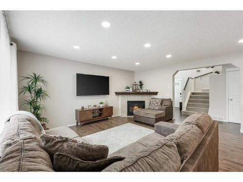 13 Brightondale Park Se, Calgary, AB - Indoor Photo Showing Living Room With Fireplace