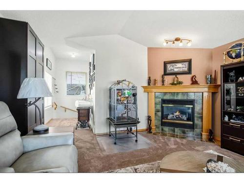 119 Anaheim Circle Ne, Calgary, AB - Indoor Photo Showing Living Room With Fireplace