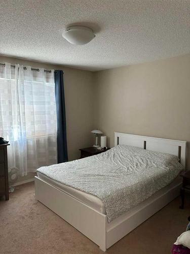 212 New Brighton Grove Se, Calgary, AB - Indoor Photo Showing Bedroom