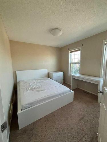 212 New Brighton Grove Se, Calgary, AB - Indoor Photo Showing Bedroom