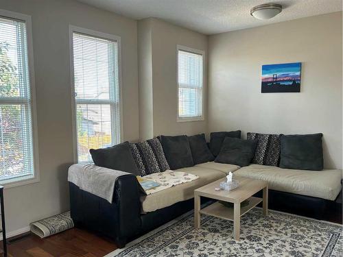 212 New Brighton Grove Se, Calgary, AB - Indoor Photo Showing Living Room