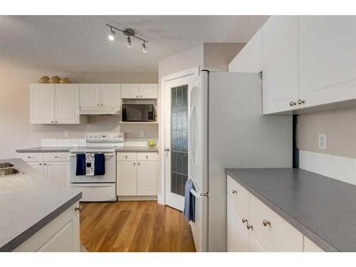 110 Invermere Drive, Chestermere, AB - Indoor Photo Showing Kitchen With Double Sink