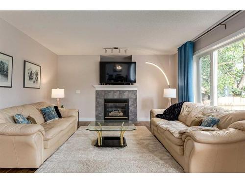 110 Invermere Drive, Chestermere, AB - Indoor Photo Showing Living Room With Fireplace