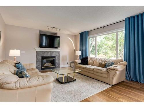 110 Invermere Drive, Chestermere, AB - Indoor Photo Showing Living Room With Fireplace