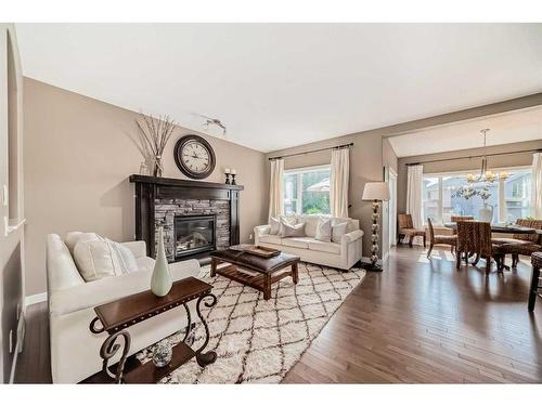 60 Aspen Hills Place Sw, Calgary, AB - Indoor Photo Showing Living Room With Fireplace