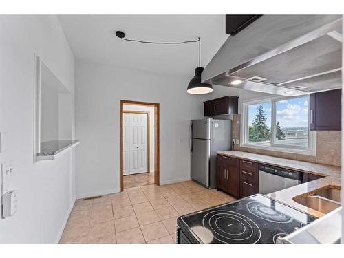 4008 Centre A Street Ne, Calgary, AB - Indoor Photo Showing Kitchen With Double Sink