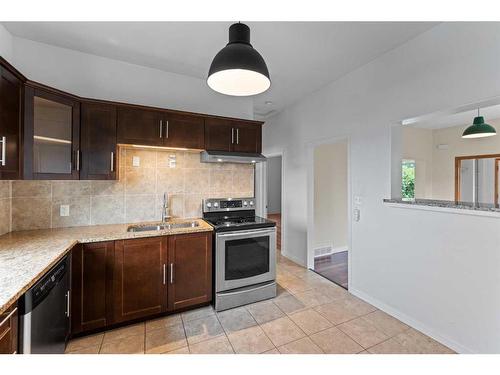 4008 Centre A Street Ne, Calgary, AB - Indoor Photo Showing Kitchen With Double Sink