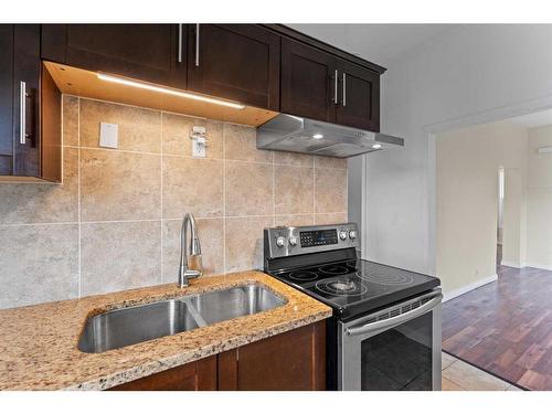 4008 Centre A Street Ne, Calgary, AB - Indoor Photo Showing Kitchen With Double Sink