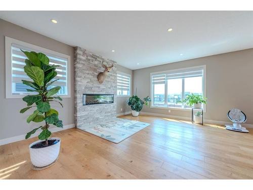 105 Carringvue Manor Nw, Calgary, AB - Indoor Photo Showing Living Room With Fireplace