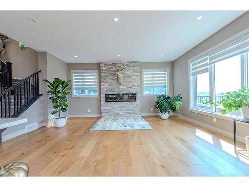 105 Carringvue Manor Nw, Calgary, AB - Indoor Photo Showing Living Room With Fireplace