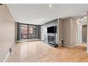 304-345 4 Avenue Ne, Calgary, AB  - Indoor Photo Showing Living Room With Fireplace 